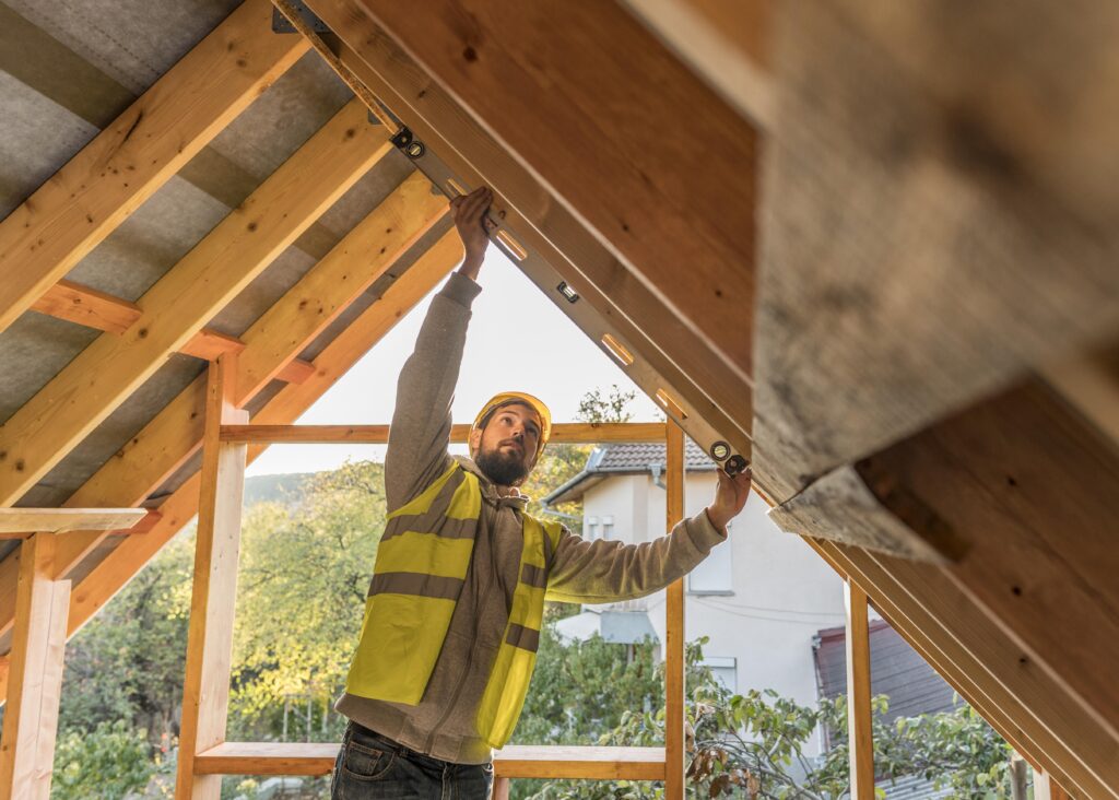 man working on home additions construction